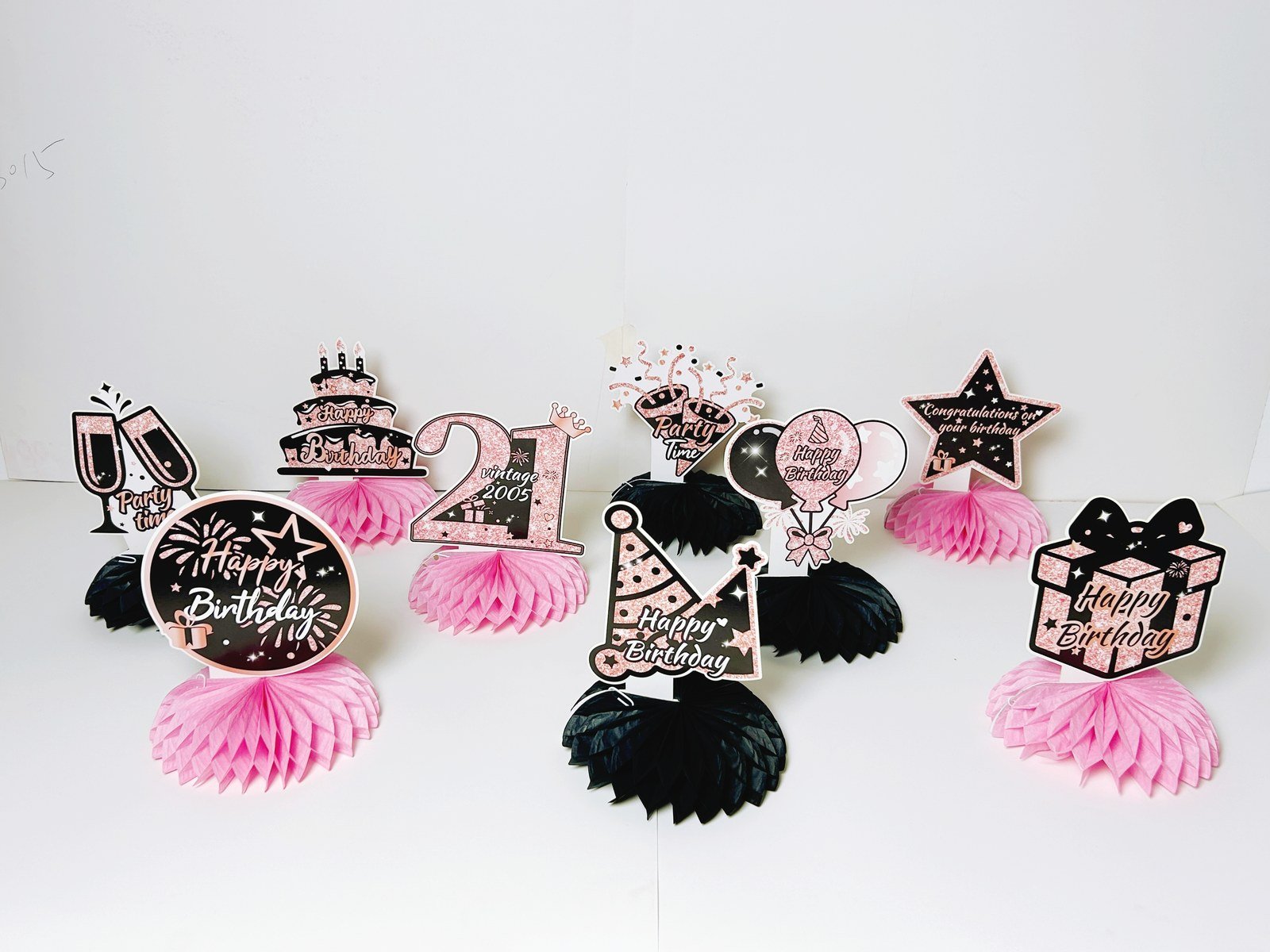 21th birthday pink honeycomb table decorations with nine black and pink pieces — additional view