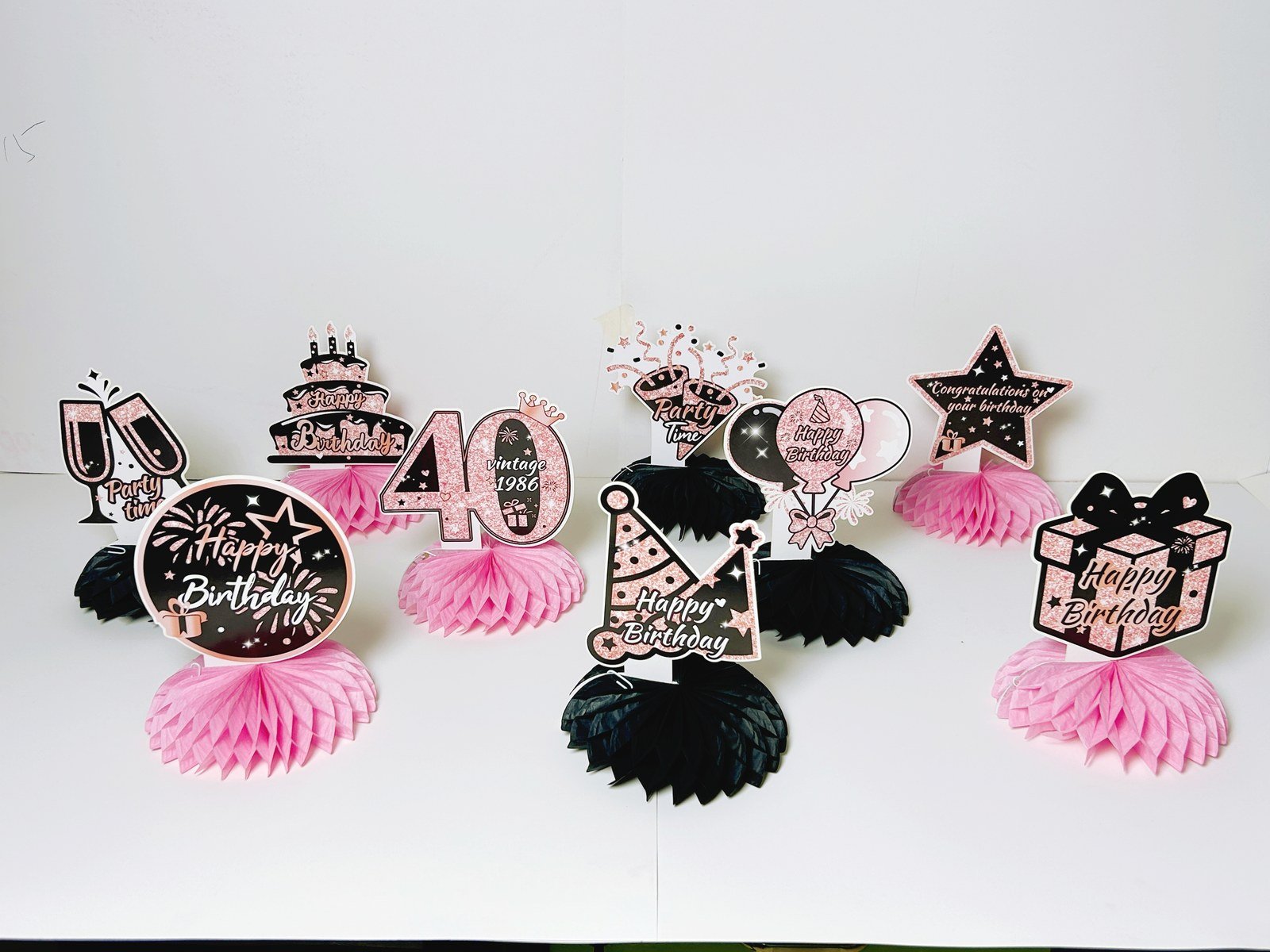 40th birthday pink honeycomb table decorations with nine black and pink pieces — additional view