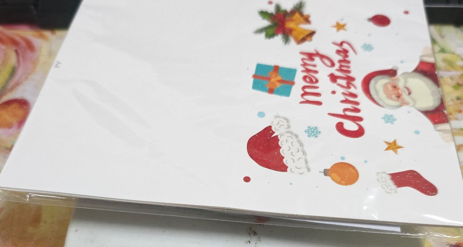 Christmas greeting cards set A4 — white Christmas card with Santa, bells and gift motifs in a protective sleeve